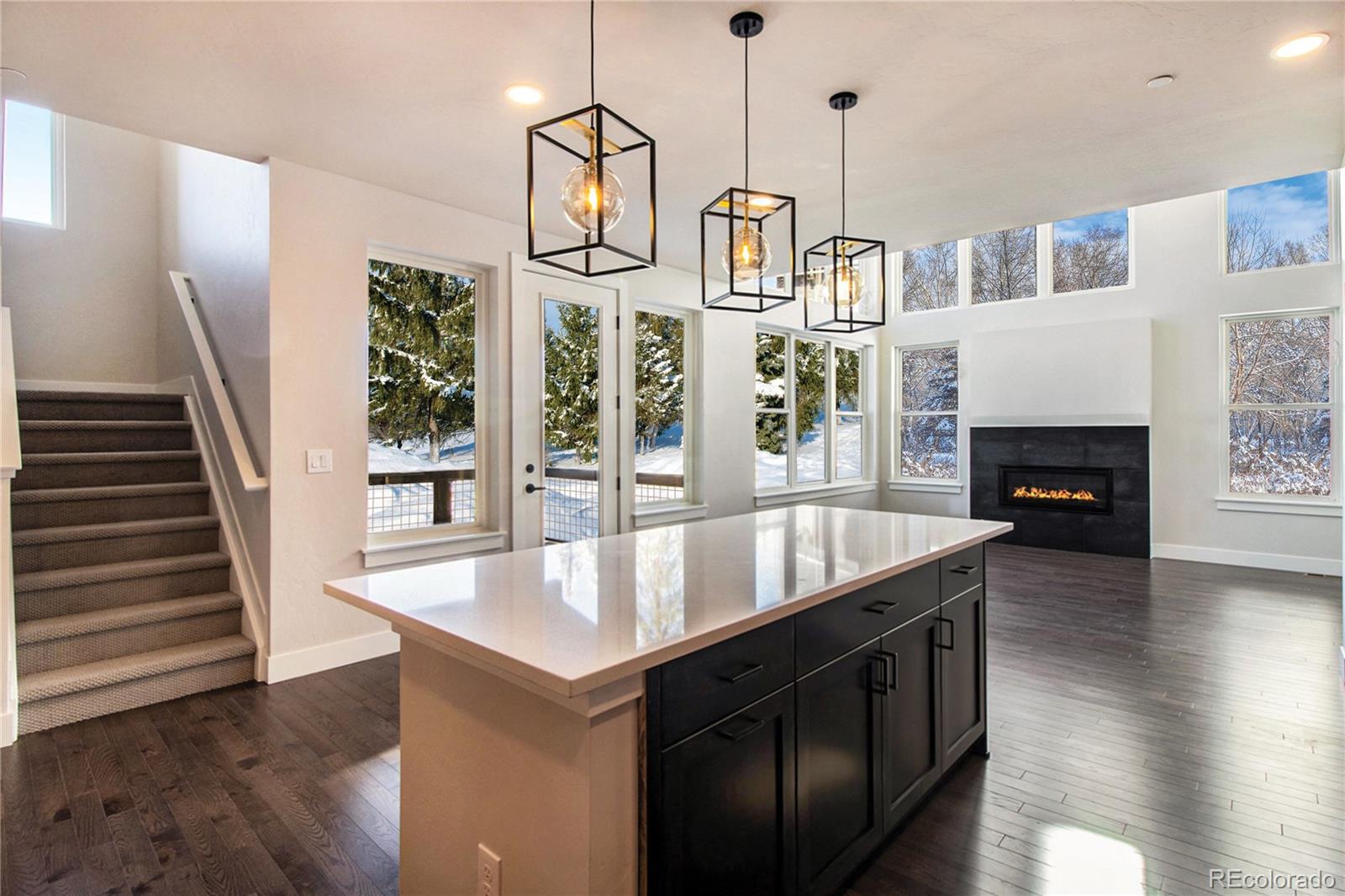 98 High Grove Loop Winter Park, CO 80482 - Photo 12 of 24 a kitchen with stainless steel appliances granite countertop a stove and a wooden floor