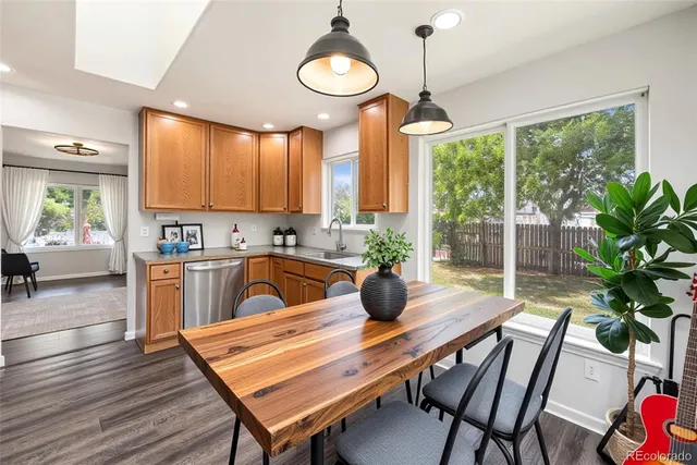 a view of a dining room with furniture window and wooden floor