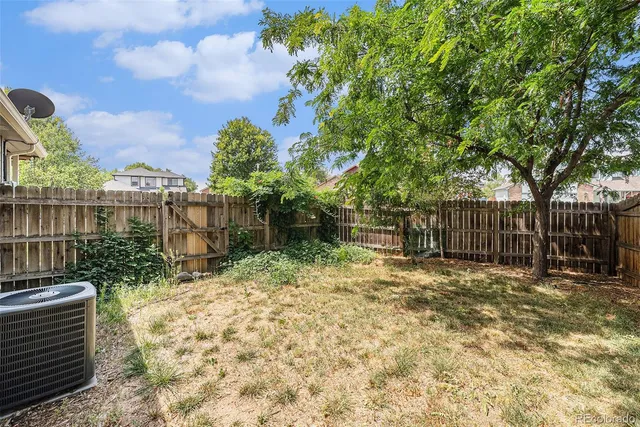 a backyard of a house with lots of green space