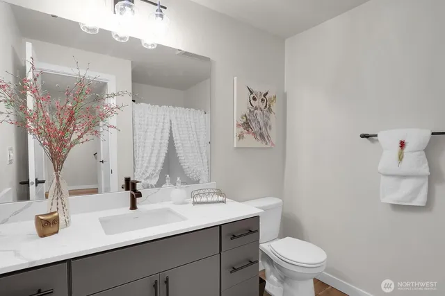 a workspace room with furniture and a window