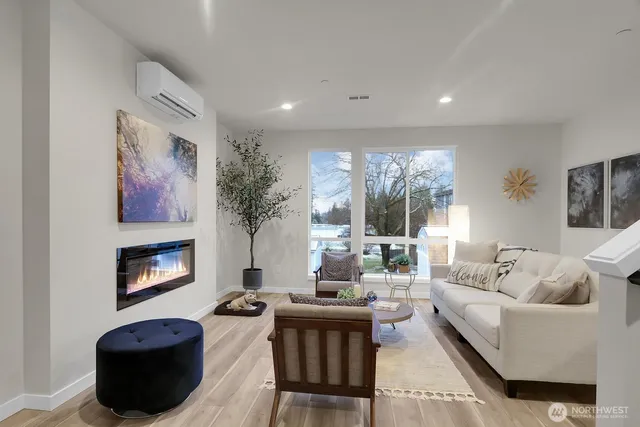 a living room with furniture fireplace and window