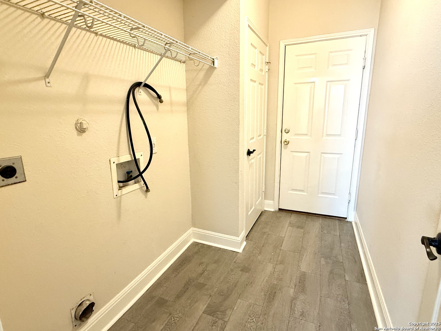 3526 Blackstone Run San Antonio, TX 78259 - Photo 13 of 18 a view of a room with wooden floor and windows