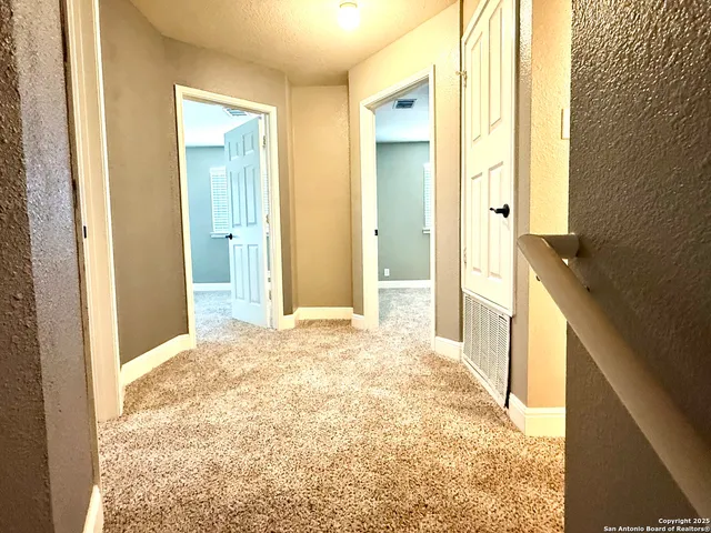 a view of a bathroom with sink and shower
