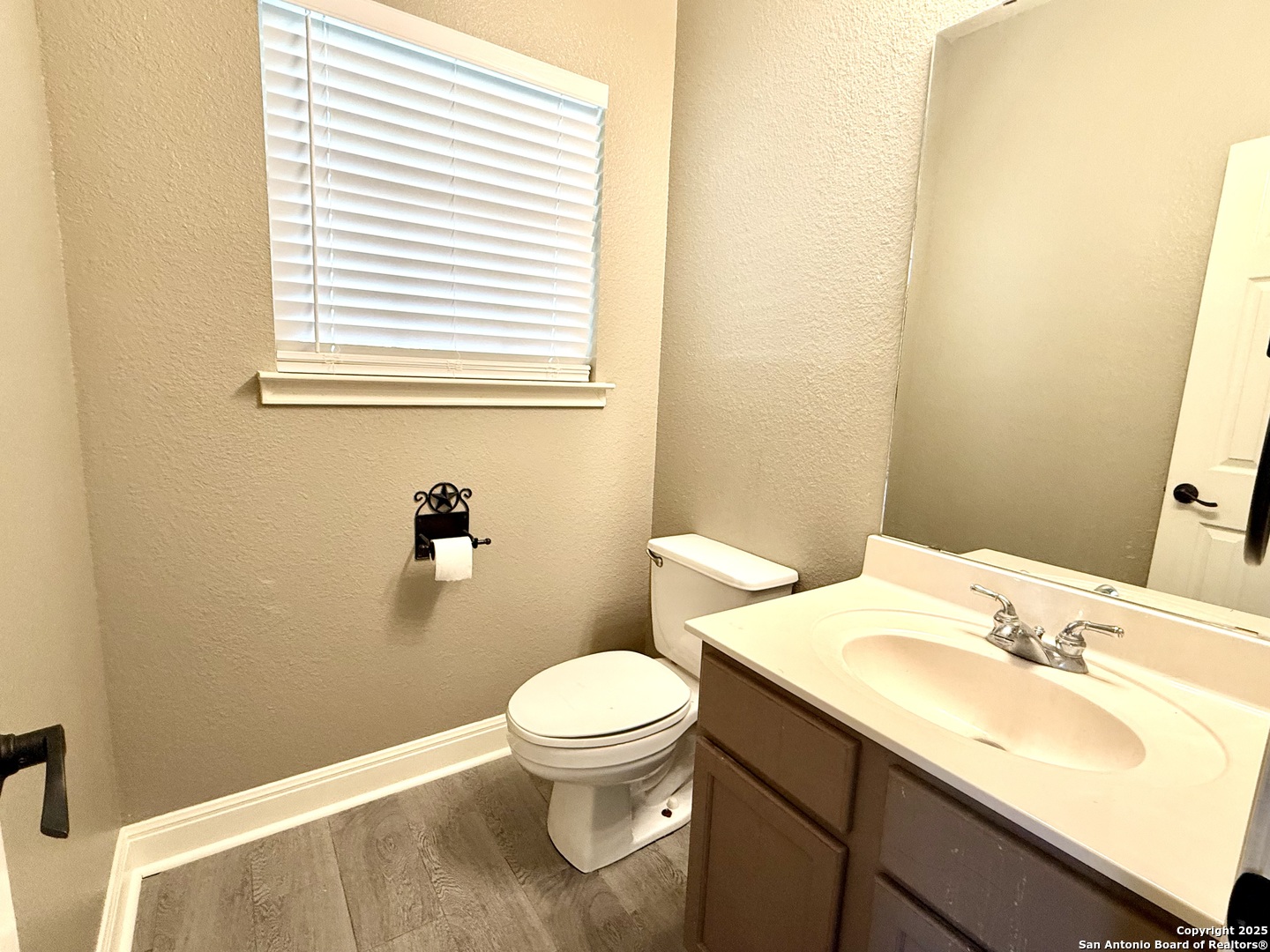 3526 Blackstone Run San Antonio, TX 78259 - Photo 3 of 18 a bathroom with a sink a toilet and a mirror