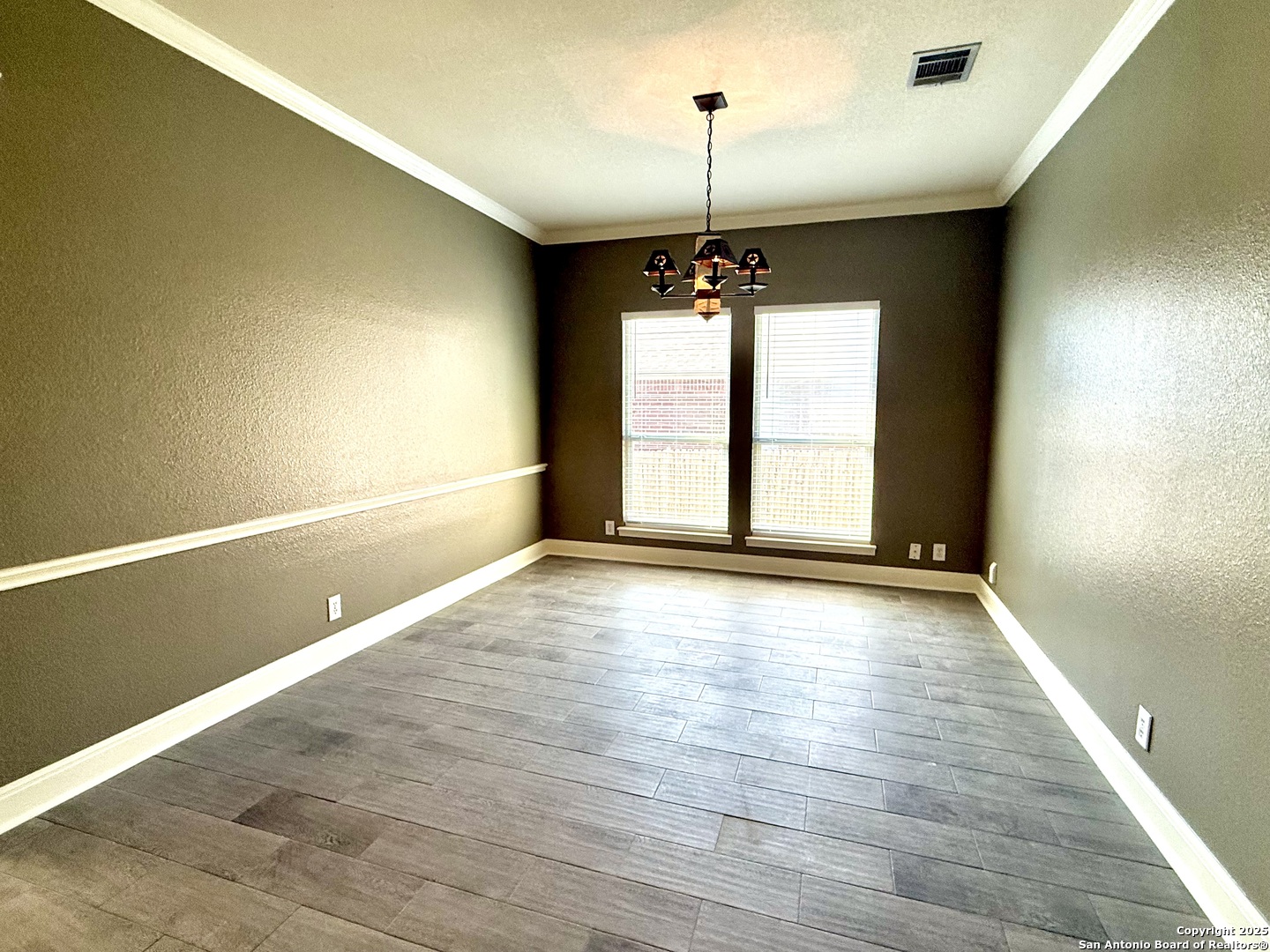 3526 Blackstone Run San Antonio, TX 78259 - Photo 4 of 18 a view of an empty room with window and wooden floor
