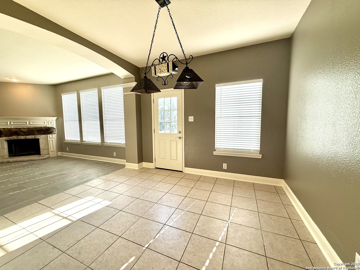 3526 Blackstone Run San Antonio, TX 78259 - Photo 7 of 18 a view of an empty room with a window and chandelier