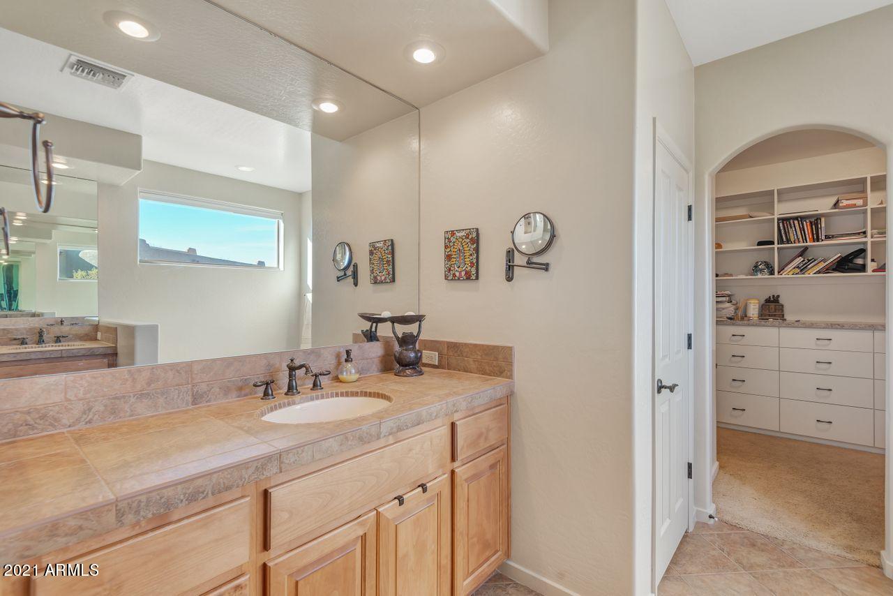 27802 North Quail Spring Road Rio Verde, AZ 85263 - Photo 15 of 35 a bathroom with a sink double vanity and a mirror
