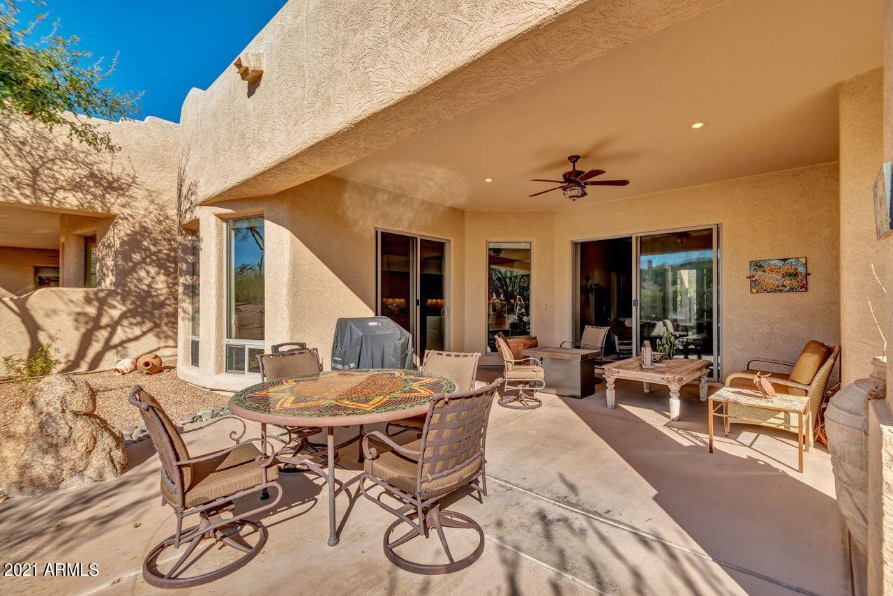 27802 North Quail Spring Road Rio Verde, AZ 85263 - Photo 4 of 35 a view of a patio with couches table and chairs and potted plants