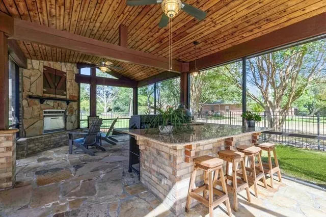 a view of a dining room with furniture a chandelier and wooden floor