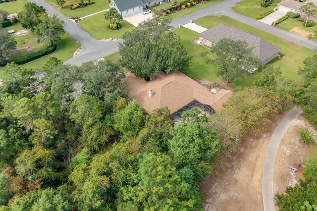 a kitchen with stainless steel appliances granite countertop a sink a stove a microwave and cabinets