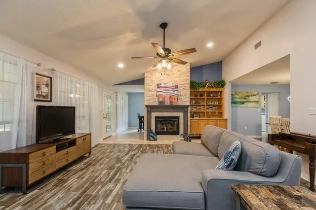 a kitchen with stainless steel appliances granite countertop a sink and a stove