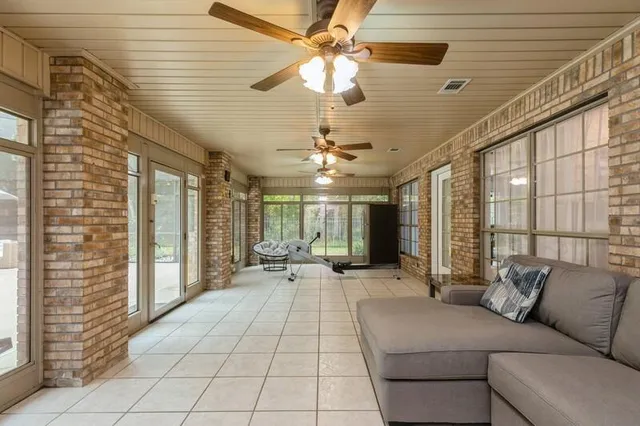 an aerial view of a house with outdoor space lake view and boat