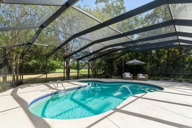 a living room with fireplace furniture and a flat screen tv