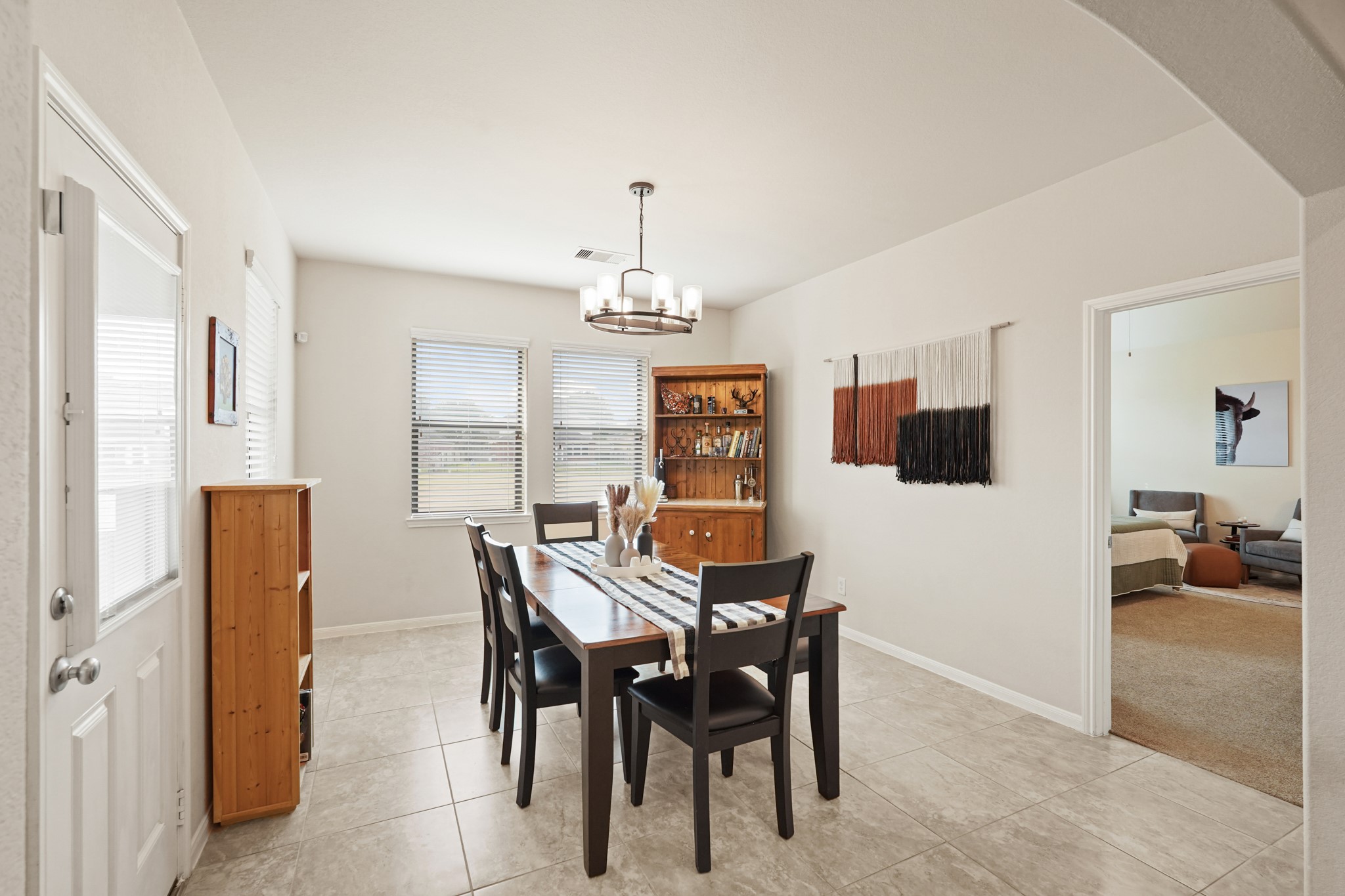 2027 Wembley Way Rosenberg, TX 77471 - Photo 15 of 28 a view of a dining room with furniture and chandelier