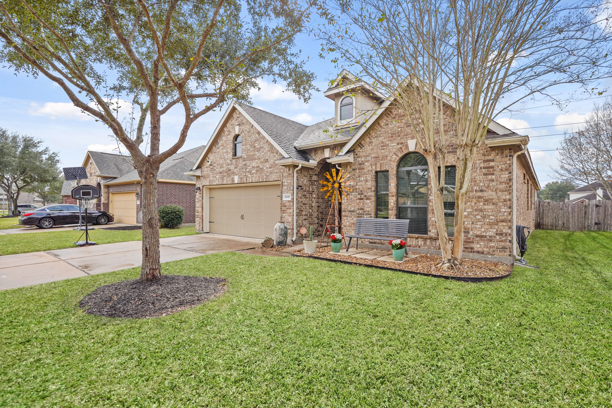 2027 Wembley Way Rosenberg, TX 77471 - Photo 2 of 28 a front view of a house with garden