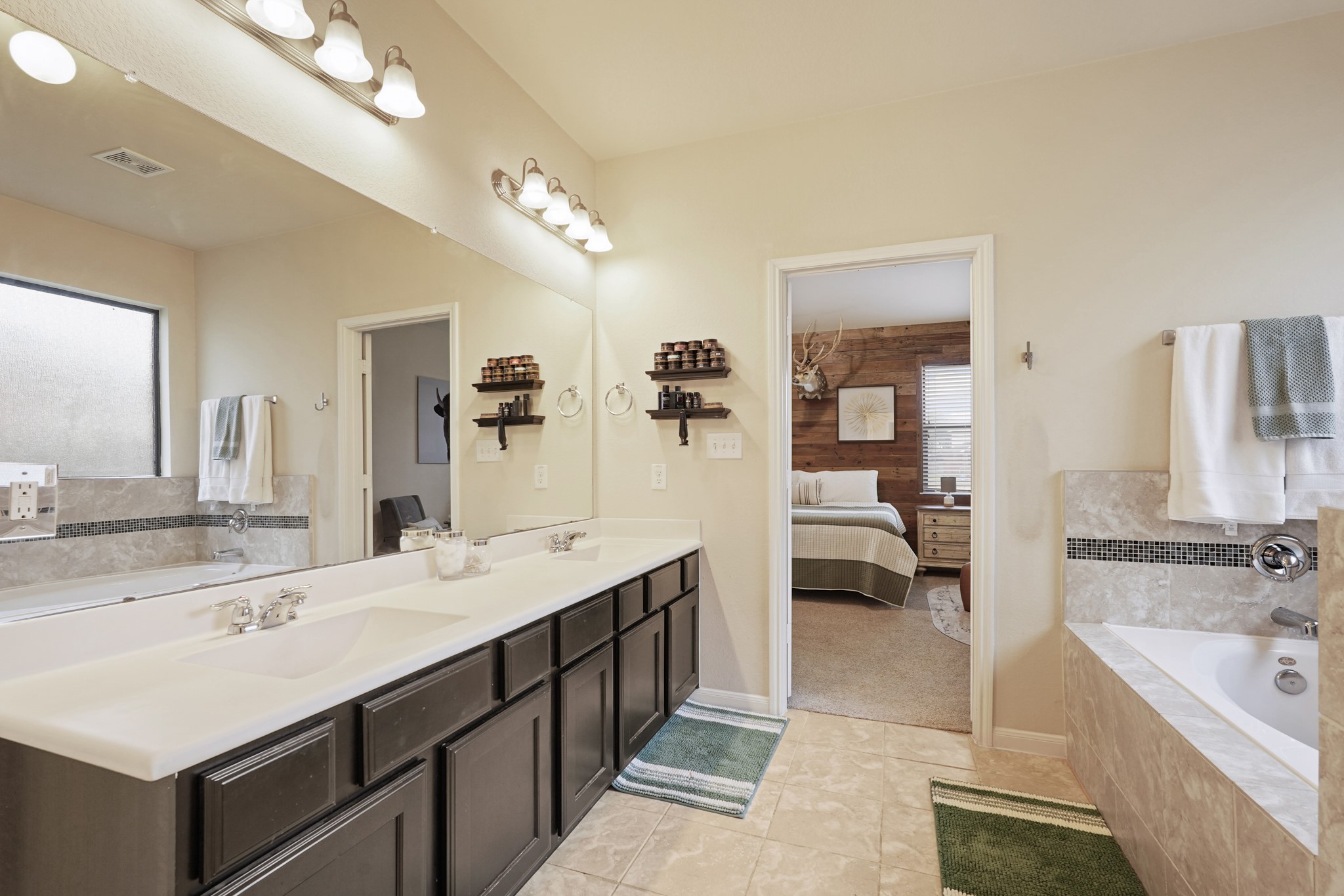 2027 Wembley Way Rosenberg, TX 77471 - Photo 21 of 28 a en suite bathroom with a double vanity sink mirror and shower