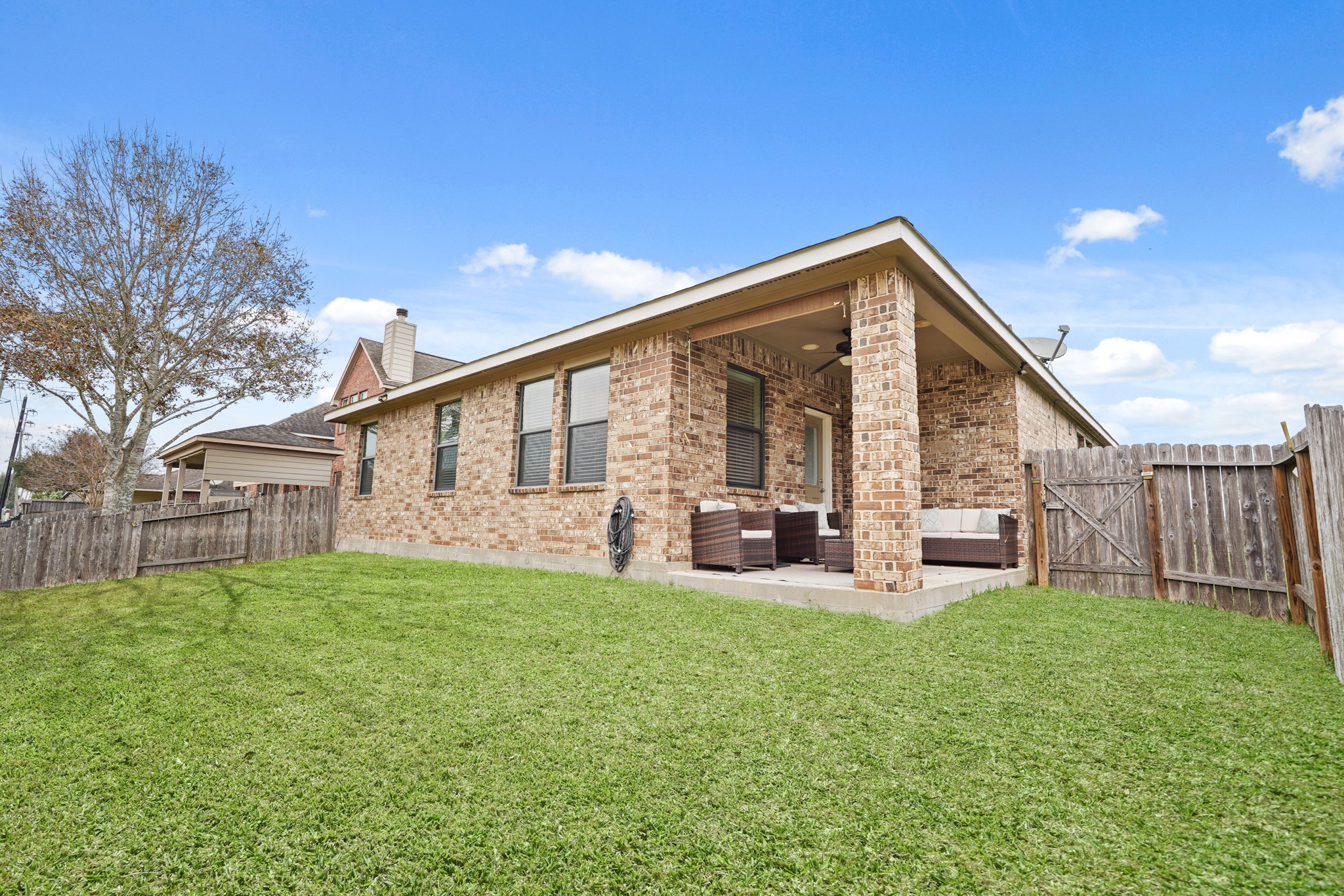 2027 Wembley Way Rosenberg, TX 77471 - Photo 25 of 28 a view of a house with backyard and sitting area