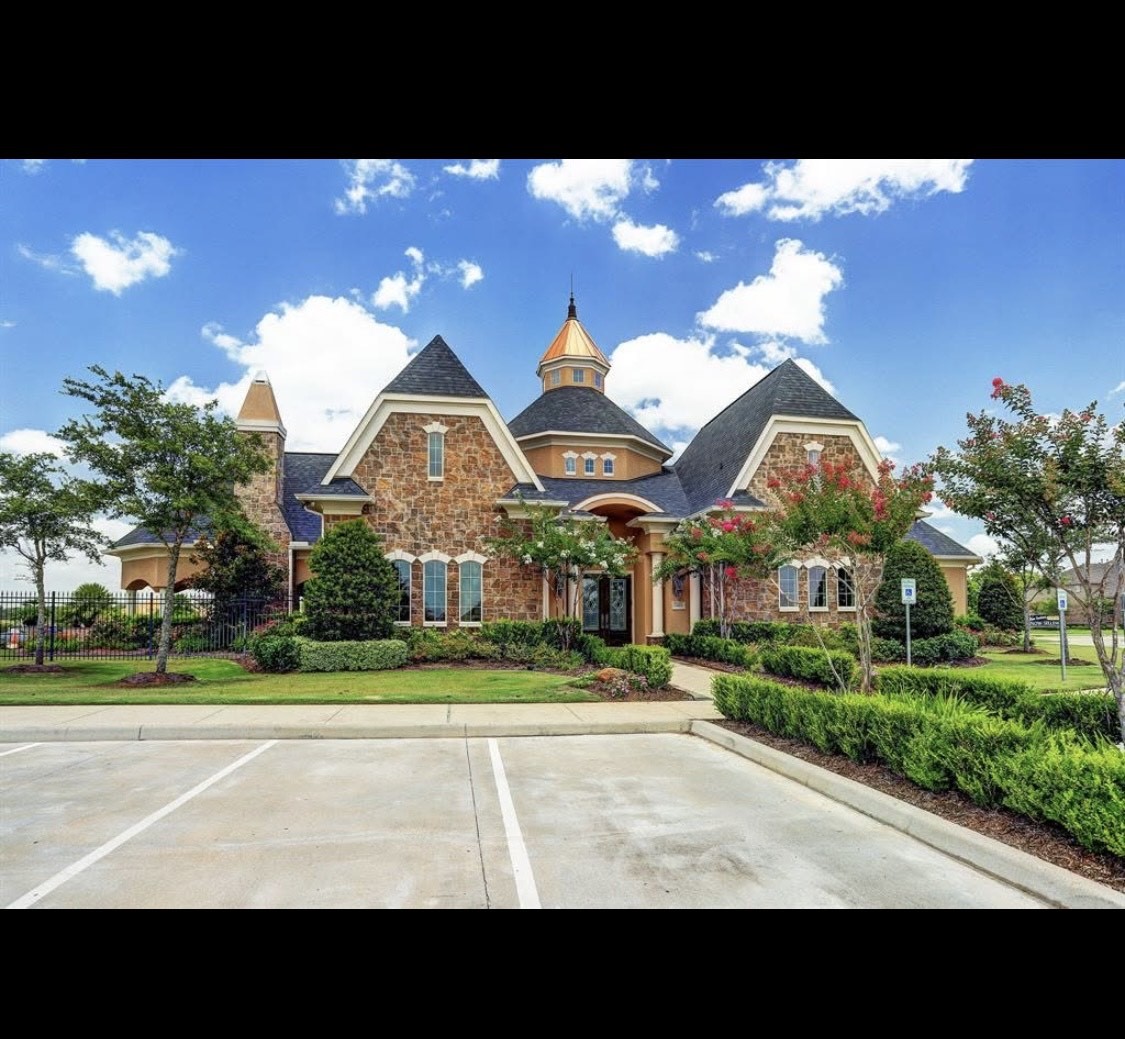 2027 Wembley Way Rosenberg, TX 77471 - Photo 26 of 28 a view of building with a big yard and large trees