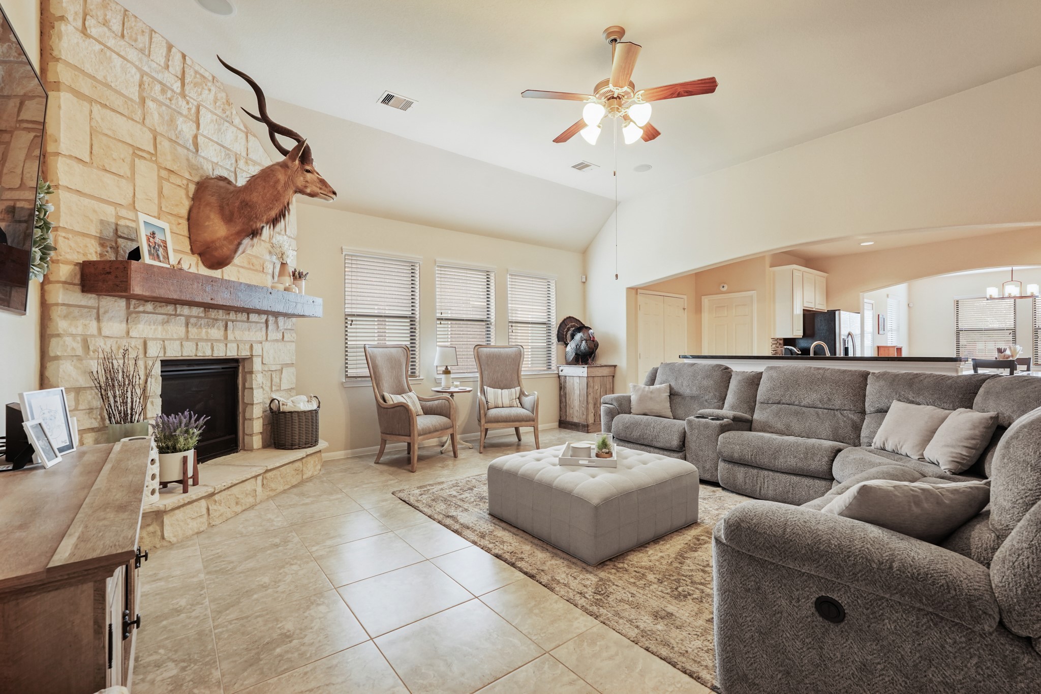 2027 Wembley Way Rosenberg, TX 77471 - Photo 9 of 28 a living room with furniture a fireplace and a ceiling fan