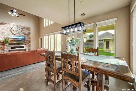 a room with dining table and chairs
