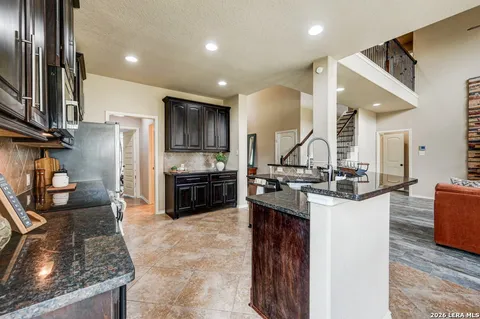 a kitchen with a sink stove and refrigerator