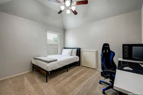 a bedroom with bed and a window