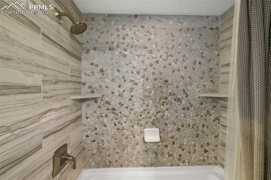 6940 Franciville Road Colorado Springs, CO 80908 - Photo 23 of 40 a bathroom with a shower