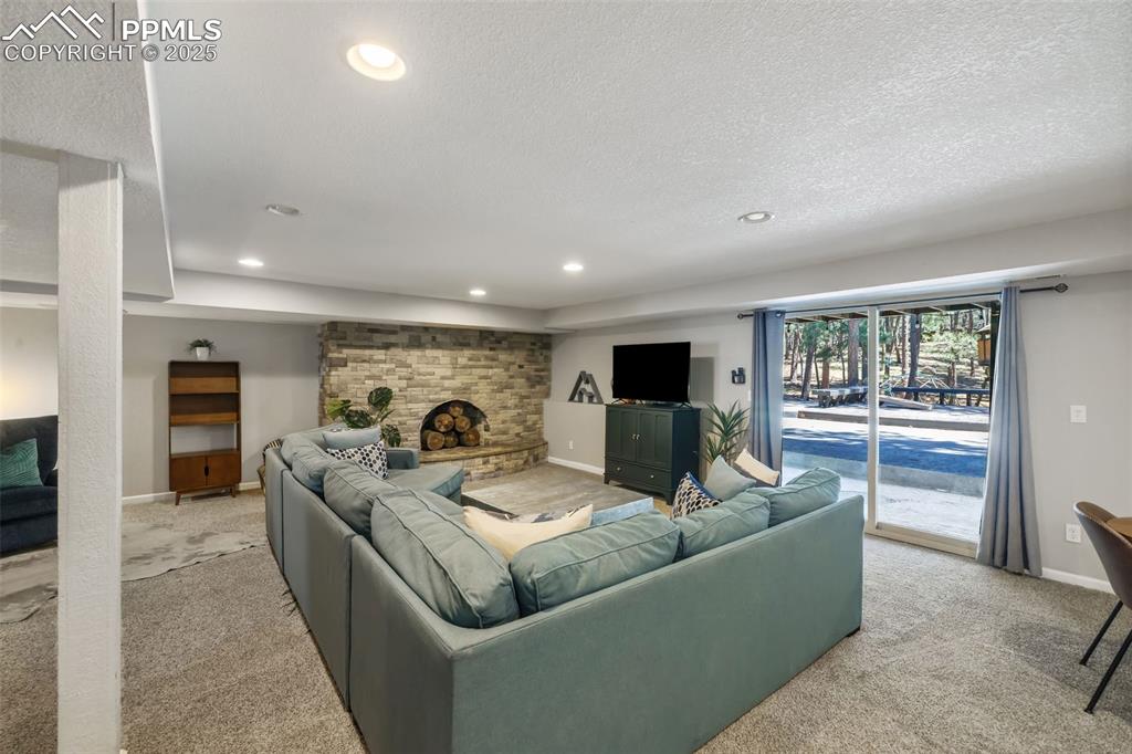 6940 Franciville Road Colorado Springs, CO 80908 - Photo 27 of 40 a living room with furniture and a flat screen tv