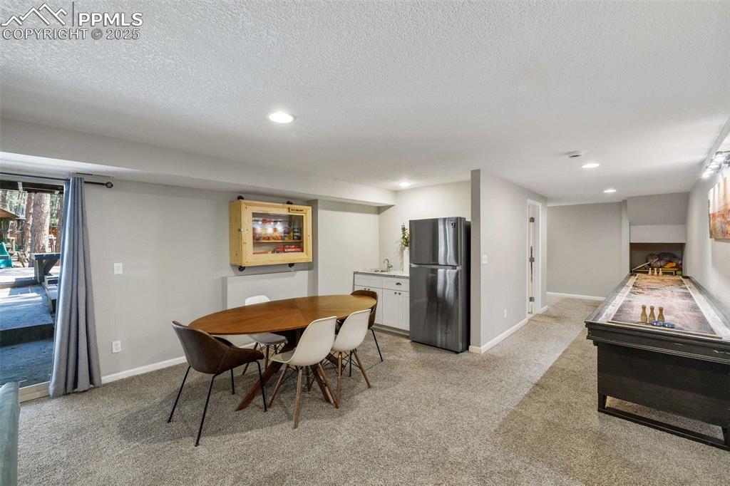 6940 Franciville Road Colorado Springs, CO 80908 - Photo 28 of 40 a dining room with furniture and window