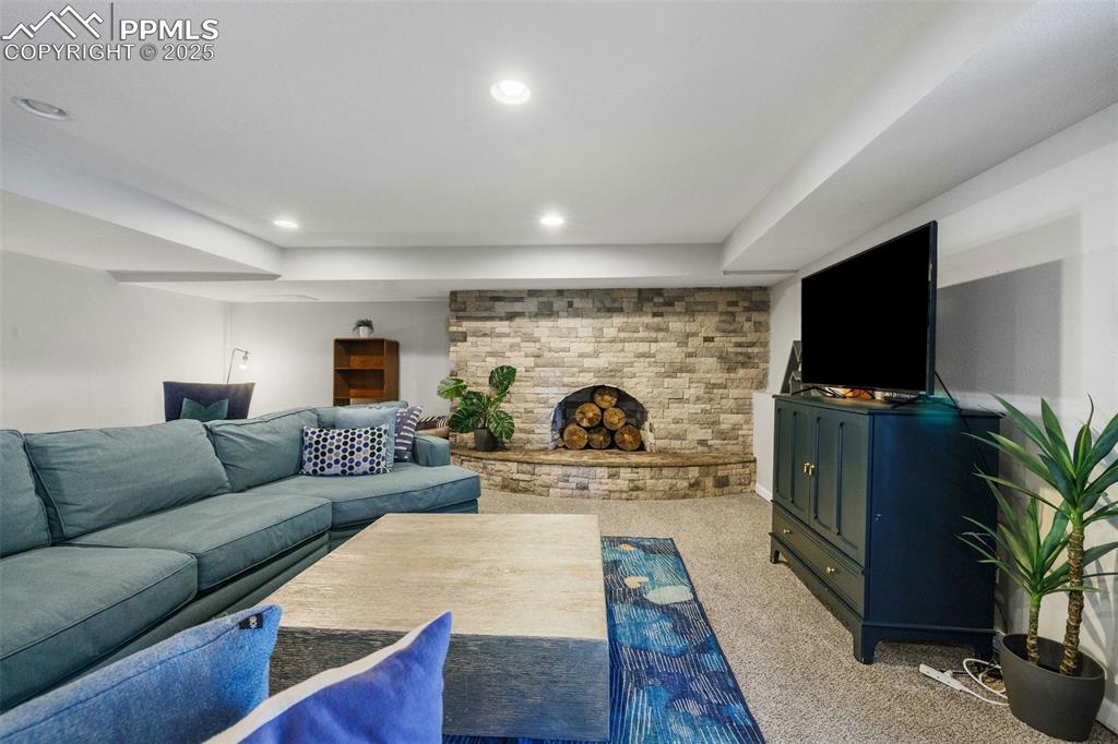6940 Franciville Road Colorado Springs, CO 80908 - Photo 29 of 40 a living room with furniture and a flat screen tv