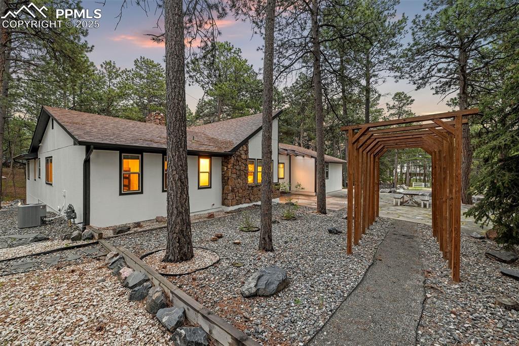 6940 Franciville Road Colorado Springs, CO 80908 - Photo 3 of 40 a front view of a house with garden