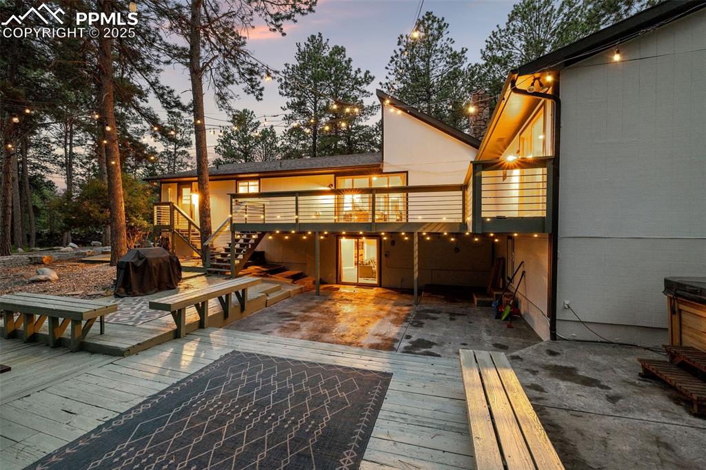 6940 Franciville Road Colorado Springs, CO 80908 - Photo 36 of 40 a view of a patio with wooden floor and iron fence