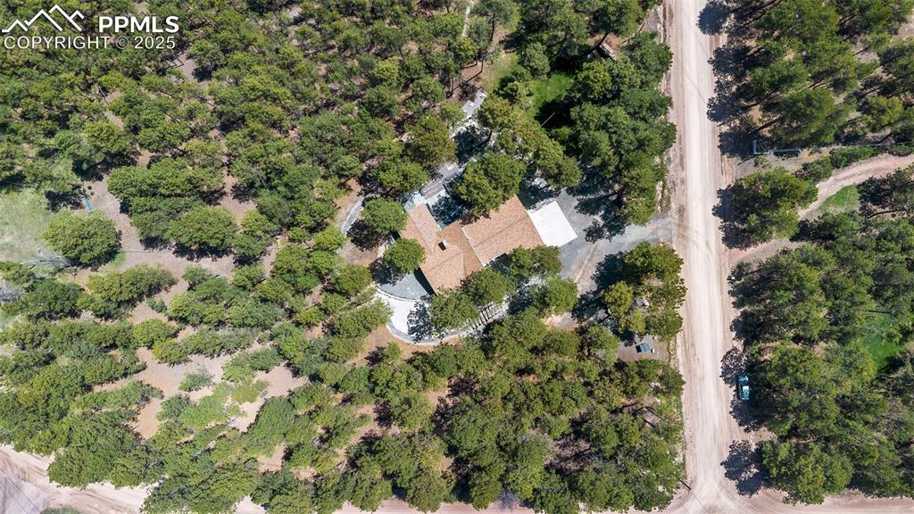 6940 Franciville Road Colorado Springs, CO 80908 - Photo 39 of 40 an aerial view of residential house with parking and trees