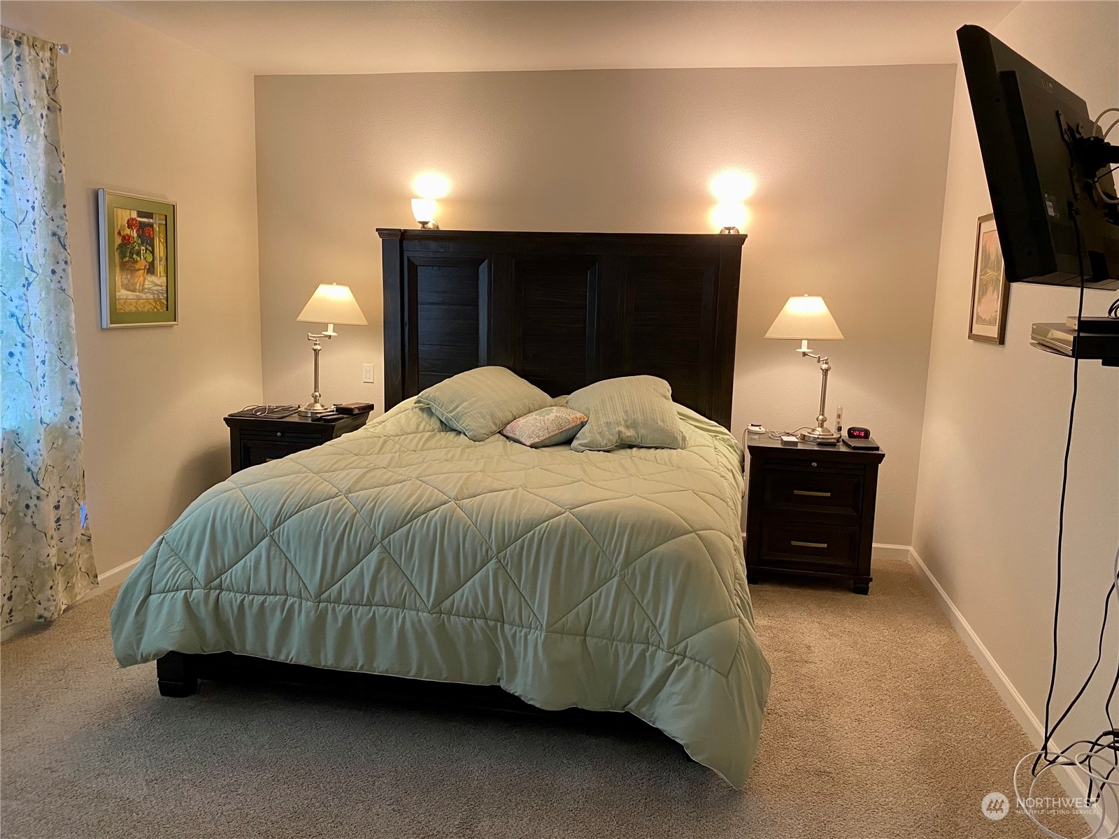 802 Mandee Street Southeast Lacey, WA 98513 - Photo 12 of 28 a bedroom with a bed and a lamp