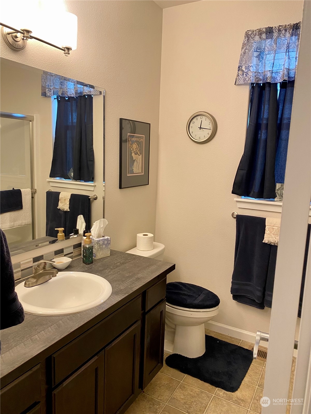 802 Mandee Street Southeast Lacey, WA 98513 - Photo 17 of 28 a bathroom with a sink and a mirror