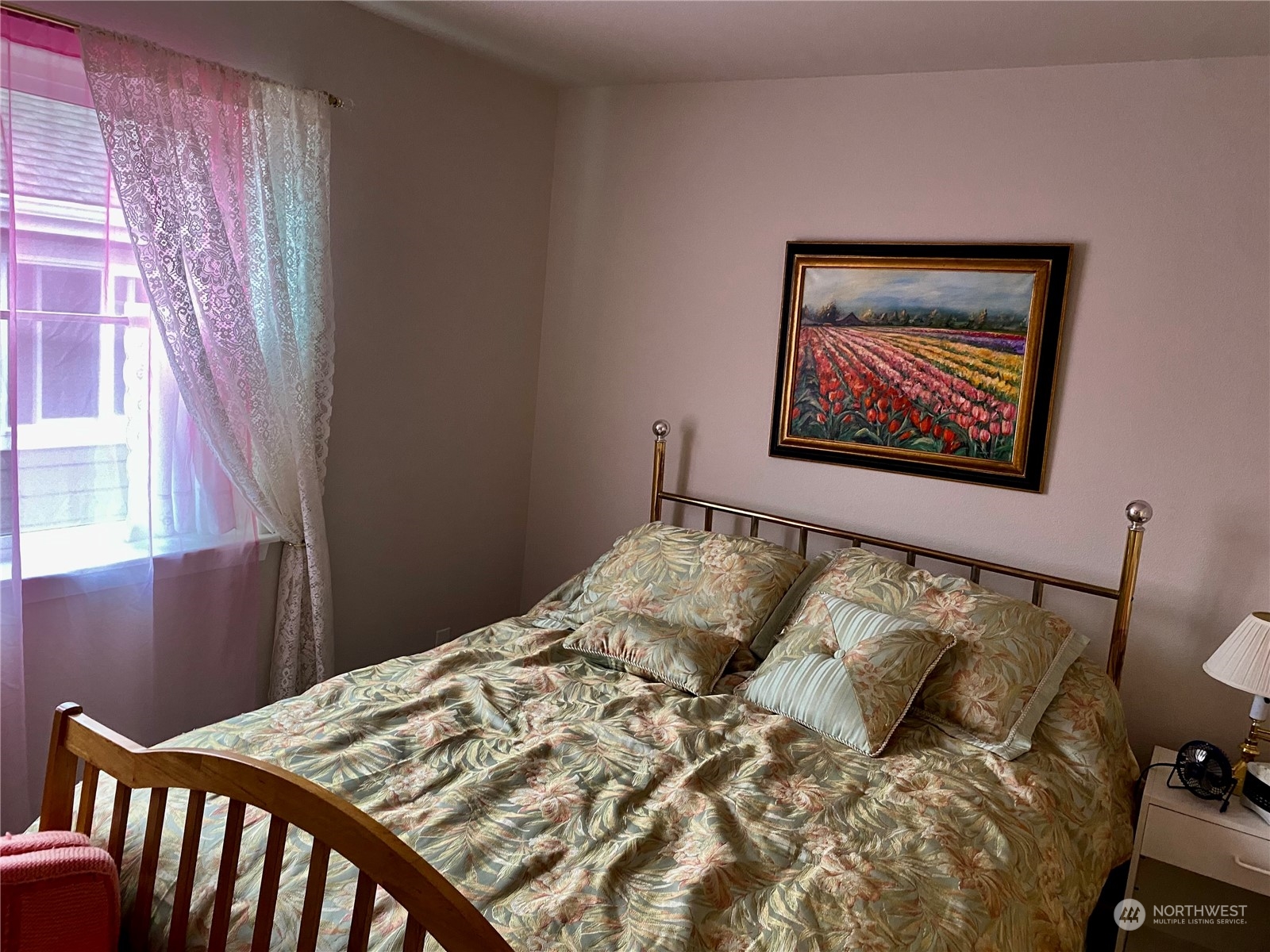 802 Mandee Street Southeast Lacey, WA 98513 - Photo 23 of 28 a bed sitting in a bedroom next to a window