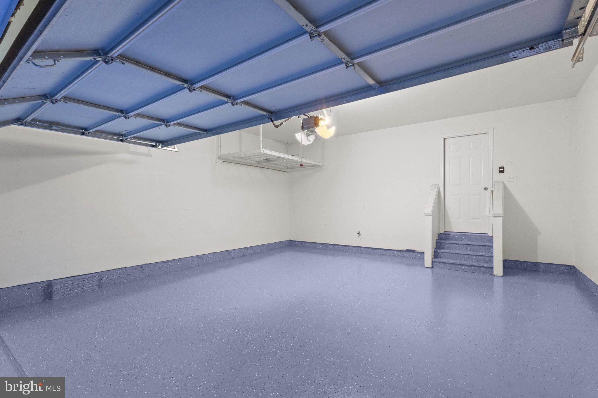 23542 Christina Ridge Square Ashburn, VA 20148 - Photo 17 of 41 Spacious garage with sleek flooring.