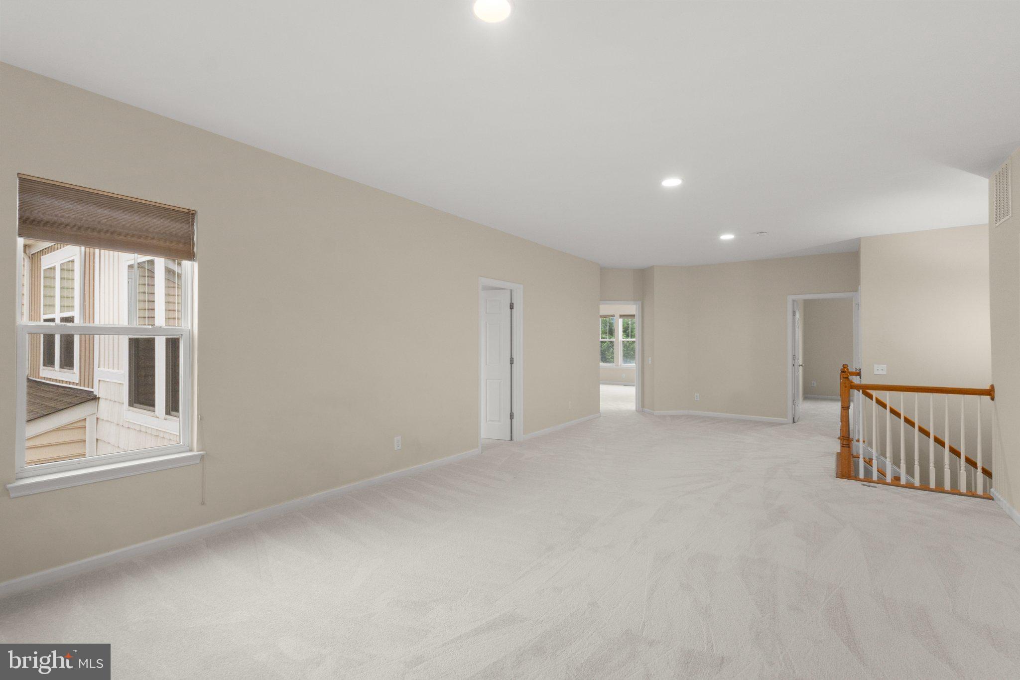 23542 Christina Ridge Square Ashburn, VA 20148 - Photo 35 of 41 Spacious, light-filled living area.