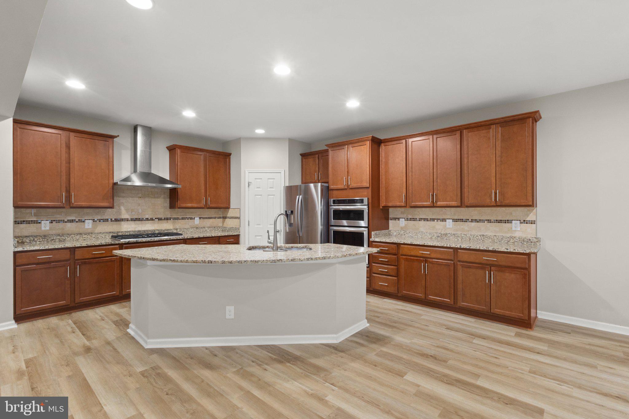 23542 Christina Ridge Square Ashburn, VA 20148 - Photo 7 of 41 Modern kitchen with elegant finishes.