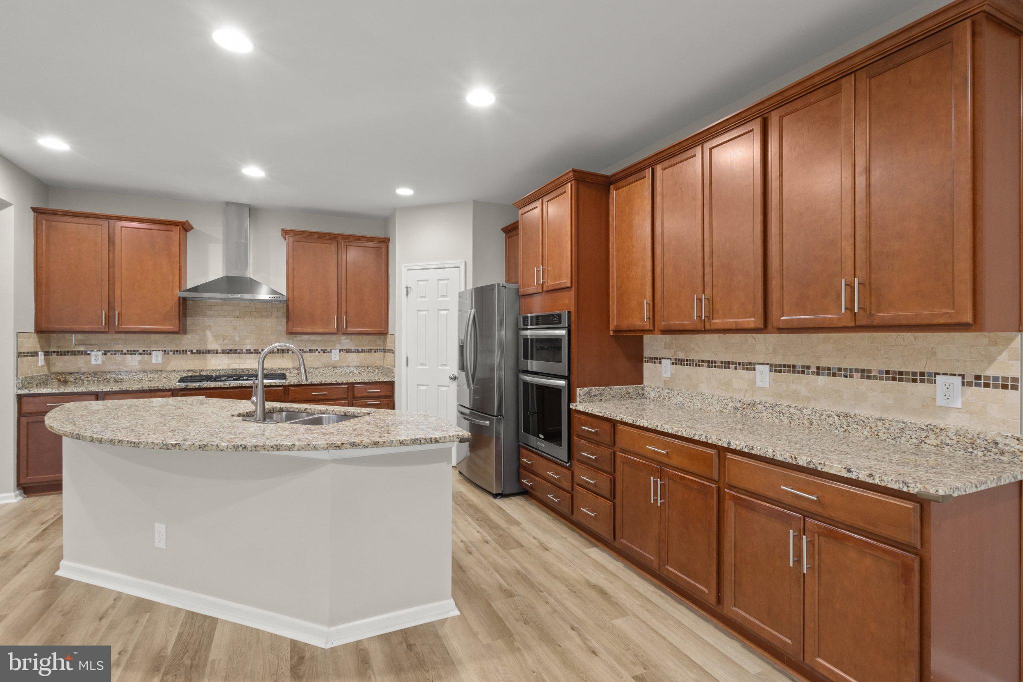 23542 Christina Ridge Square Ashburn, VA 20148 - Photo 9 of 41 Modern kitchen with elegant finishes.