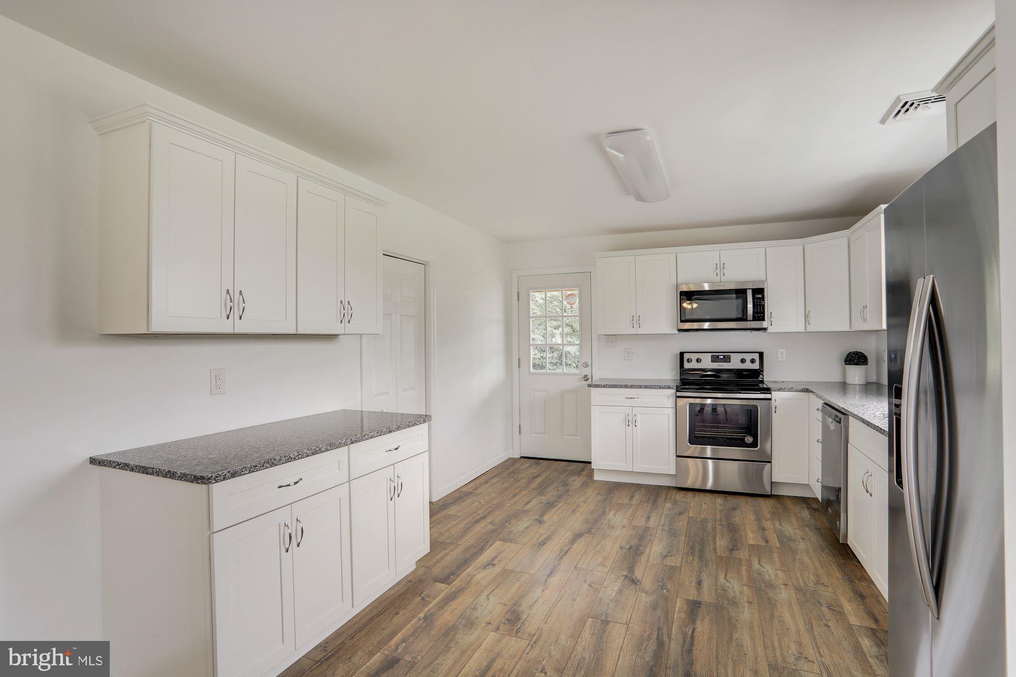 170 Compromise Road Woodstown, NJ 08098 - Photo 14 of 34 a kitchen with white cabinets stainless steel appliances and sink