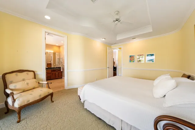 a spacious bedroom with a bed and furniture