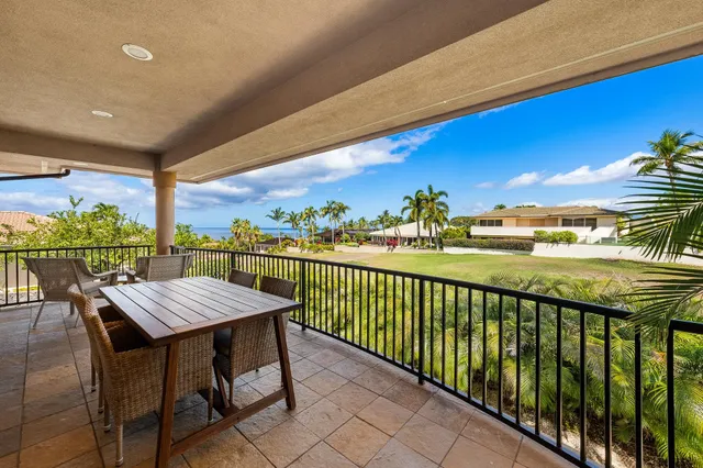 a view of a balcony with chairs