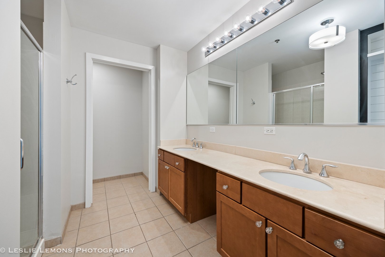 354 River Street, Unit 3407 Lemont, IL 60439 - Photo 11 of 15 a spacious bathroom with a sink and a mirror