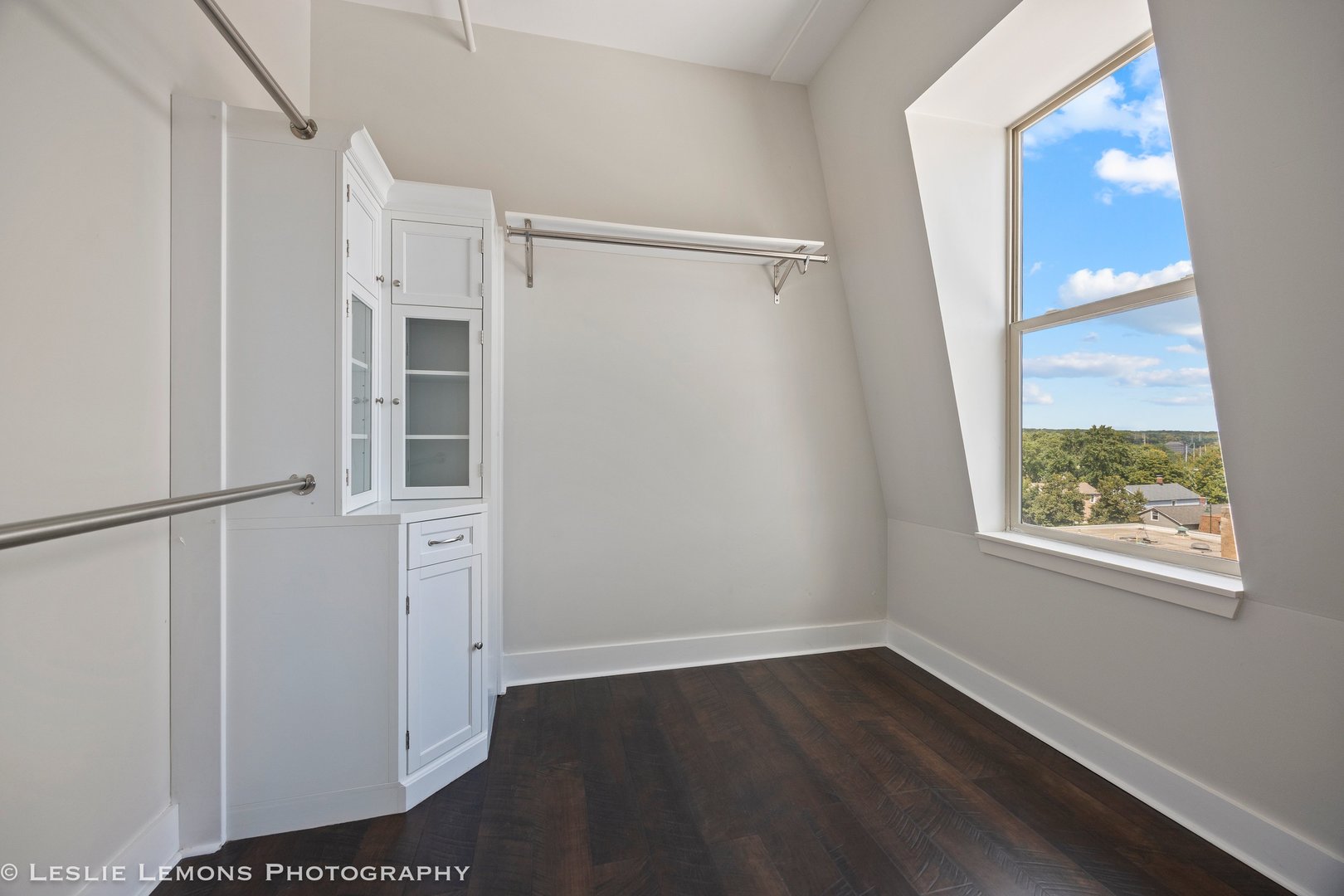 354 River Street, Unit 3407 Lemont, IL 60439 - Photo 10 of 15 an empty room with wooden floor cabinet and windows