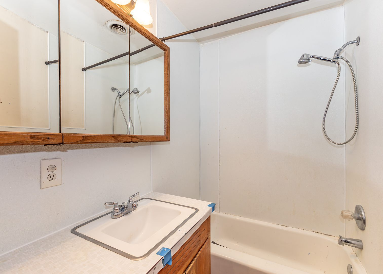 1608 3rd Street Camanche, IA 52730 - Photo 16 of 25 a bathroom with a sink and a shower