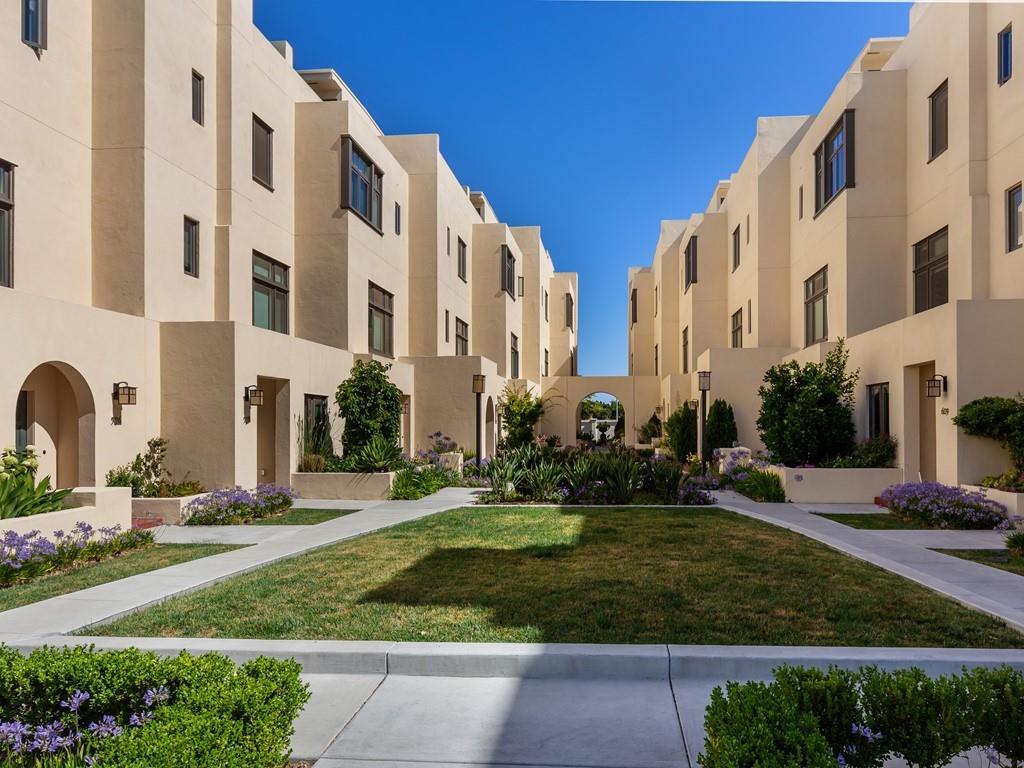 a view of a building with a yard