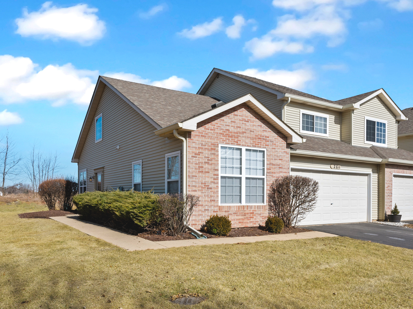 26 Rolling Oaks Road Sugar Grove, IL 60554 - Photo 1 of 25 a front view of a house with a yard and garage