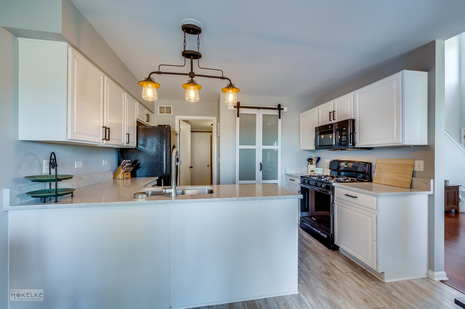 26 Rolling Oaks Road Sugar Grove, IL 60554 - Photo 11 of 25 a kitchen with stainless steel appliances granite countertop a stove top oven a sink a refrigerator and white cabinets with wooden floor