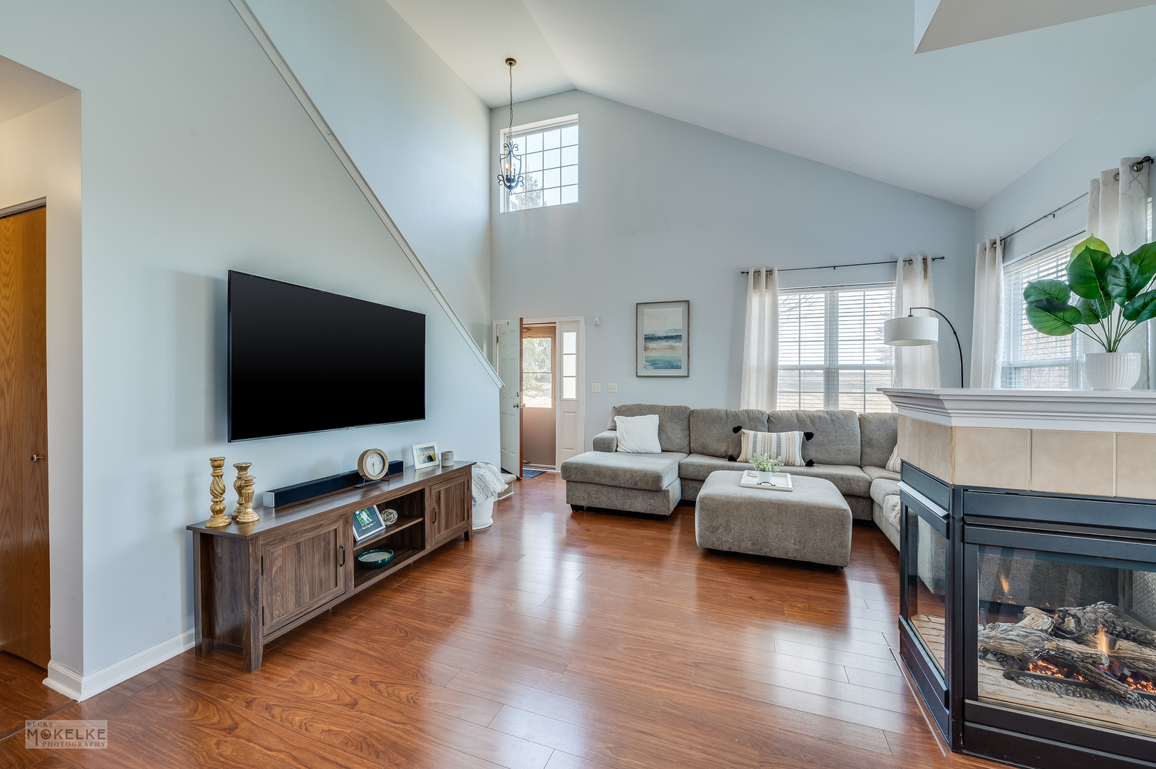 26 Rolling Oaks Road Sugar Grove, IL 60554 - Photo 4 of 25 a living room with furniture and a flat screen tv